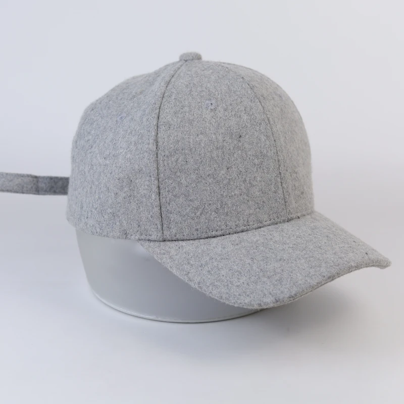 Undecorated grey felt-texture baseball cap shown from the side