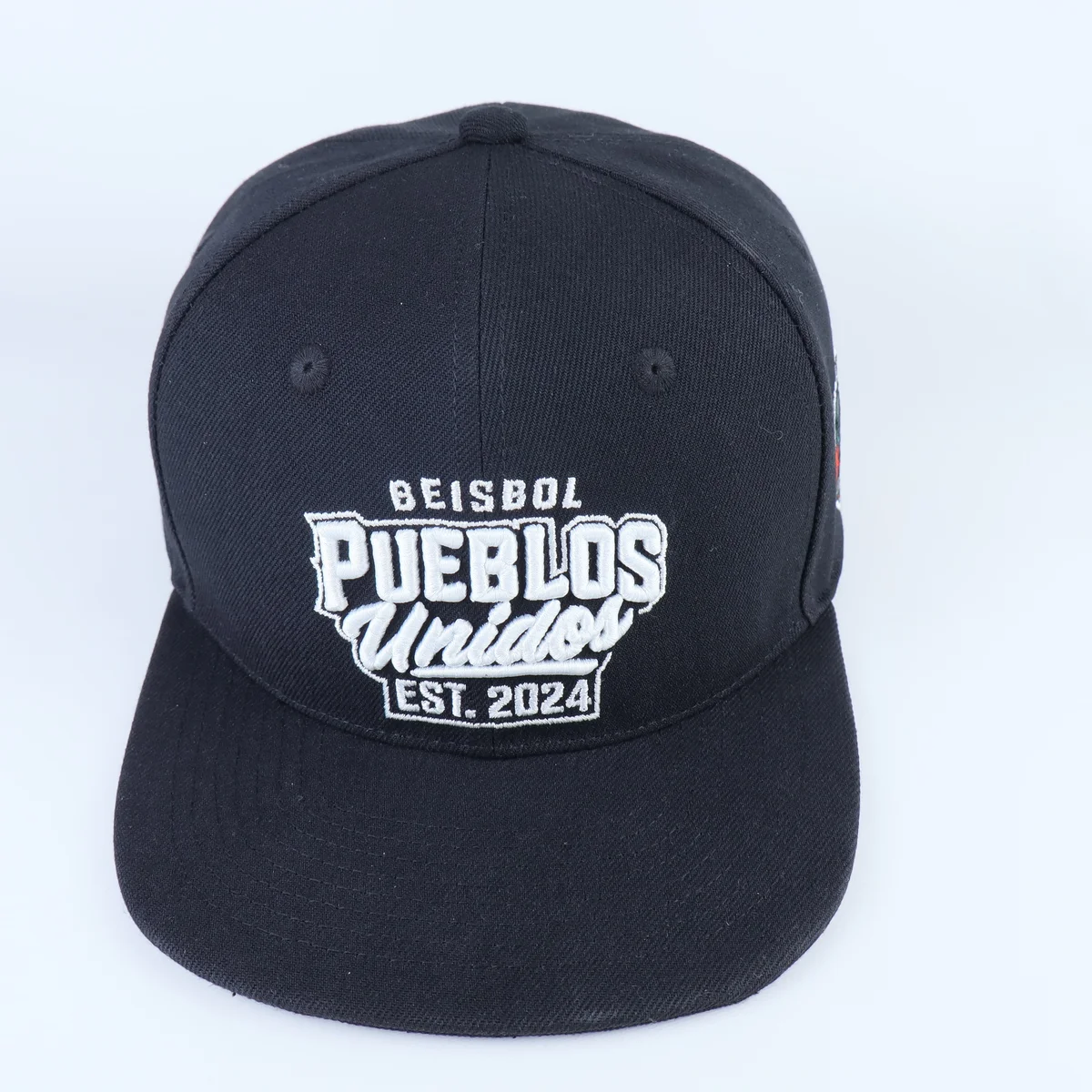 Dark navy baseball style snapback with white multi-line front embroidery